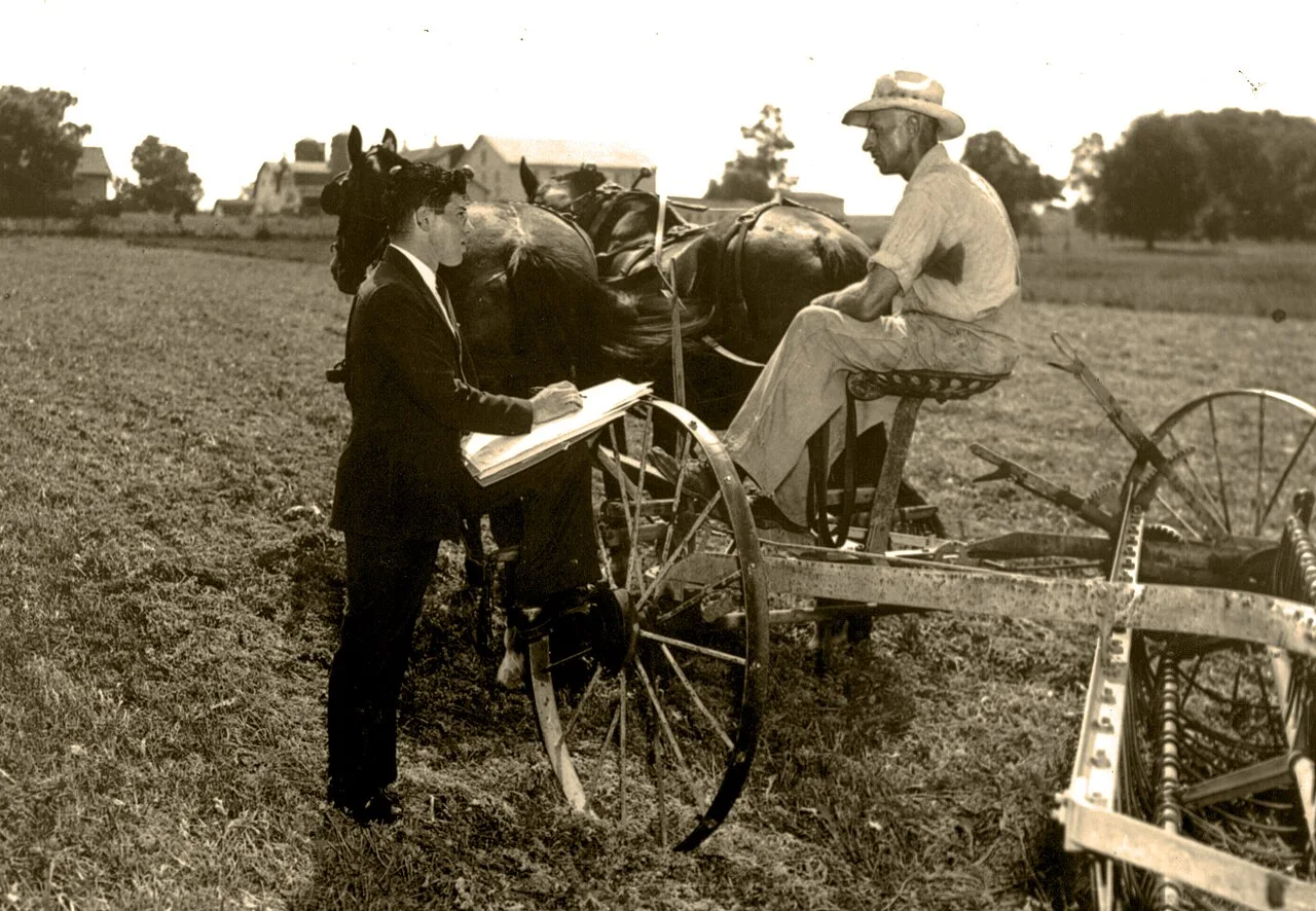 A United States census enumerator interviewing a farmer in 1940